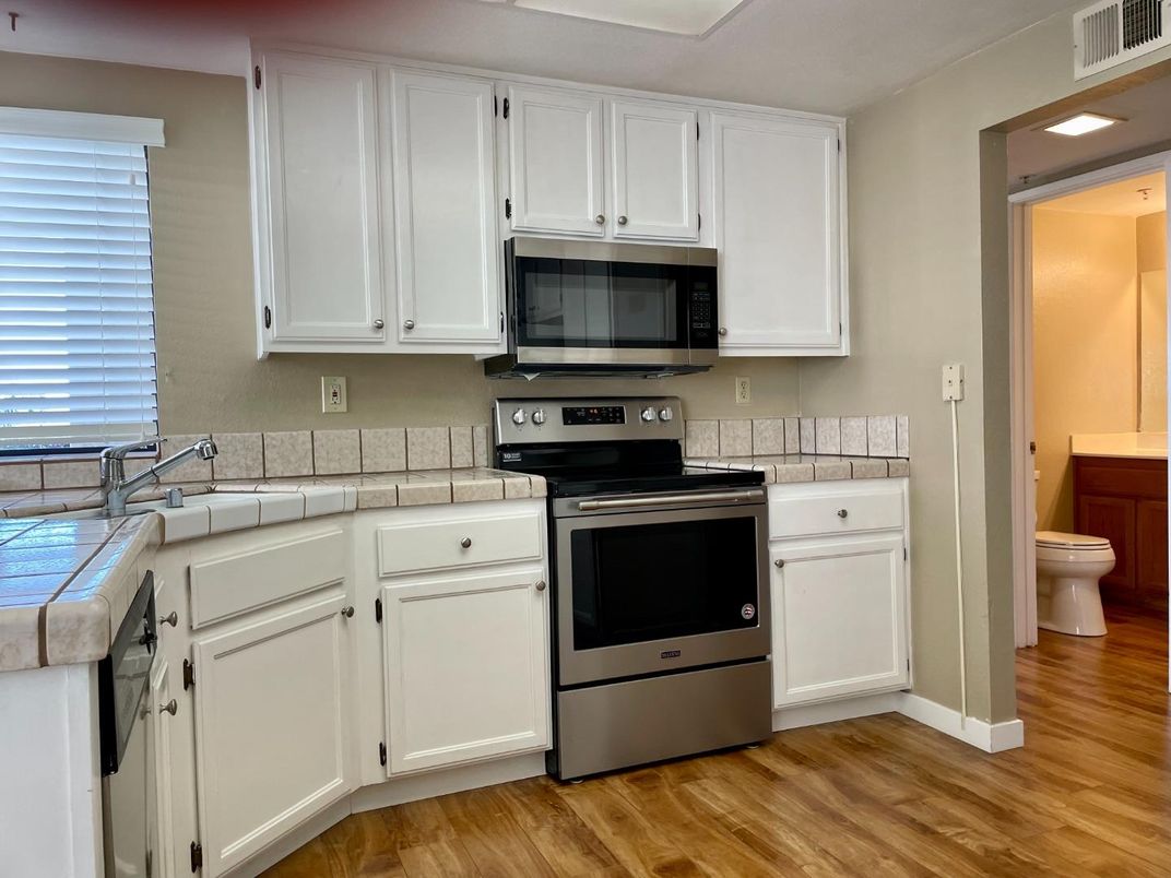 Interior, Kitchen, Tile Countertops, Wood Texture Flooring