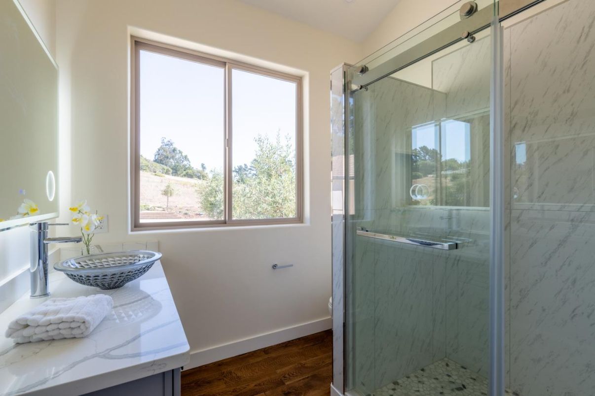Bathroom, Glass Shower, Interior, Marble Walls, Wood Texture Flooring