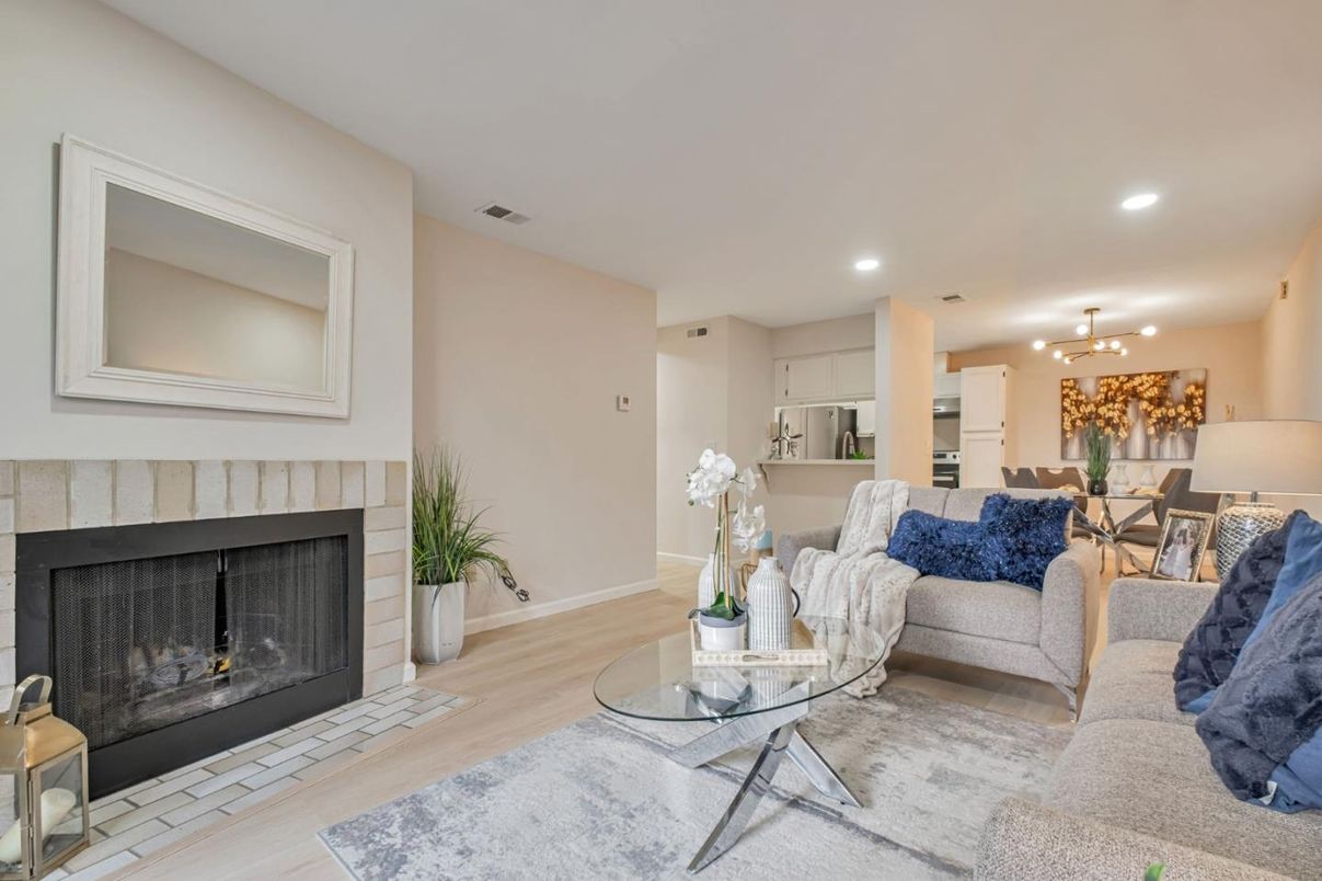 Dining room, Fireplace, Interior, Kitchen, Living room, Recessed Lighting, Stainless Steel Appliances, Wood Texture Flooring