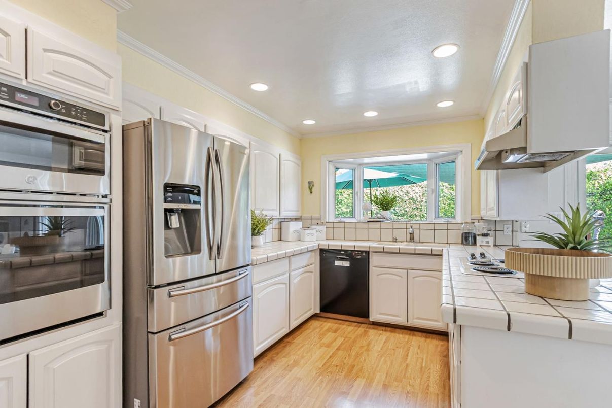 Interior, Kitchen, Recessed Lighting, Stainless Steel Appliances, Tile Countertops, Wood Texture Flooring