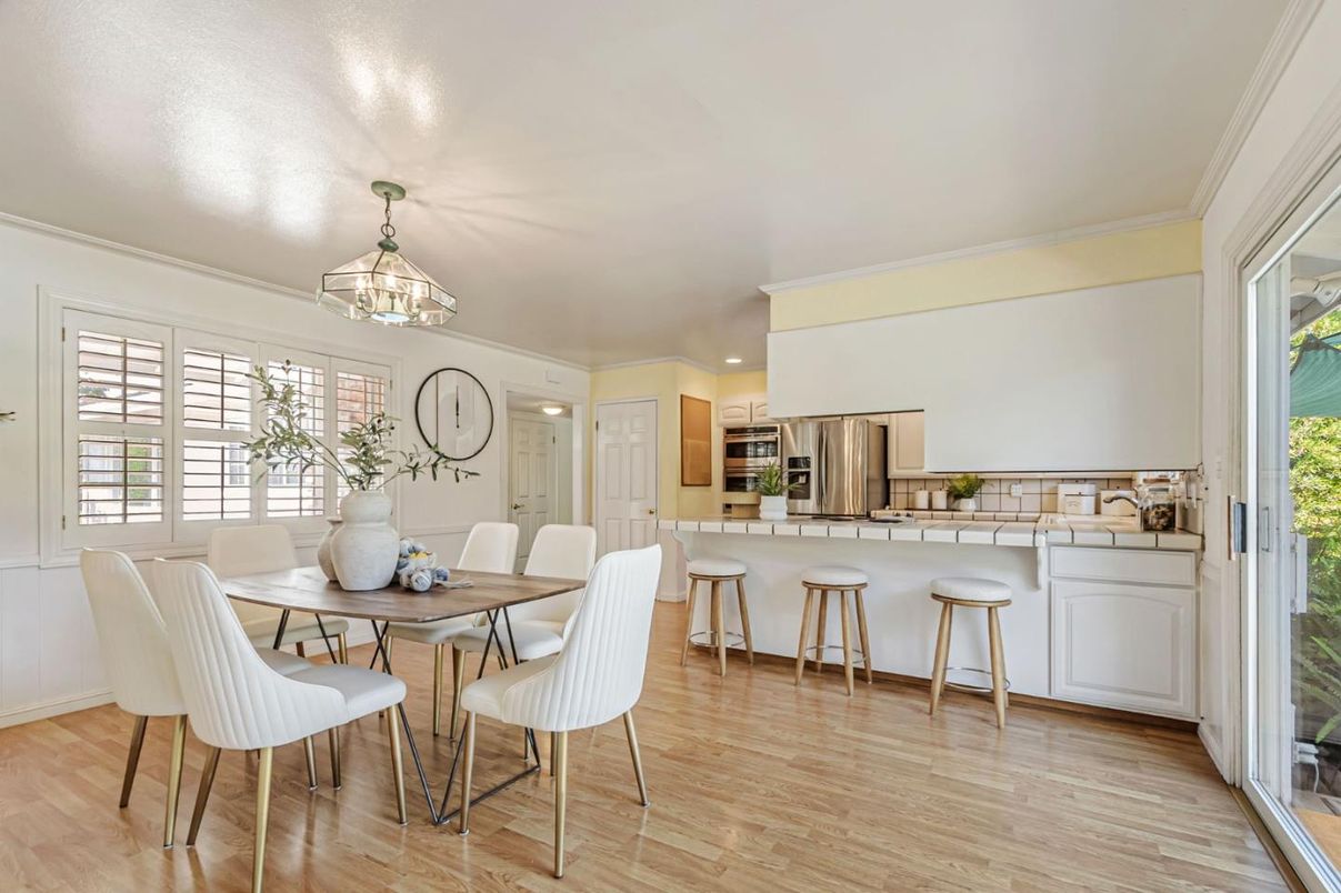 Dining room, Interior, Kitchen, Recessed Lighting, Stainless Steel Appliances, Tile Countertops, Wood Texture Flooring