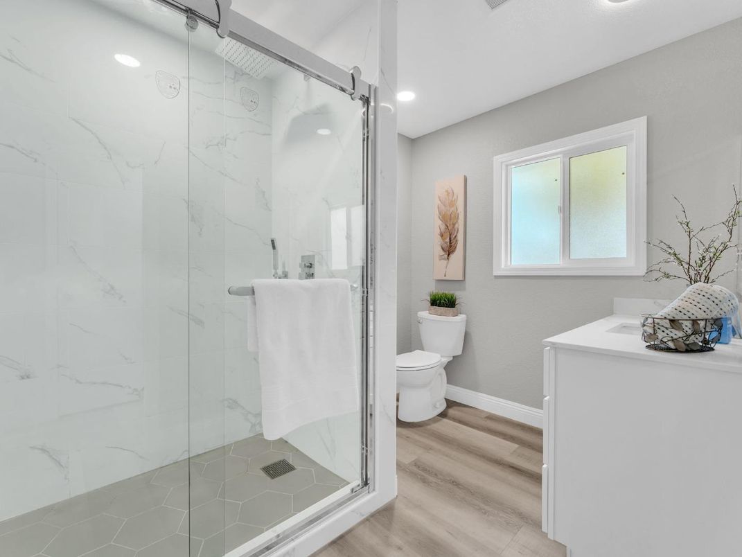 Bathroom, Glass Shower, Interior, Marble Walls, Recessed Lighting, Wood Texture Flooring