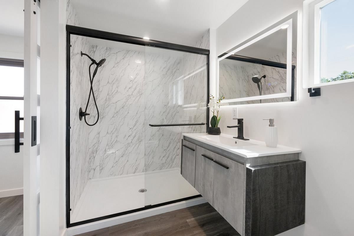 Bathroom, Glass Shower, Interior, Marble Walls, Recessed Lighting, Wood Texture Flooring