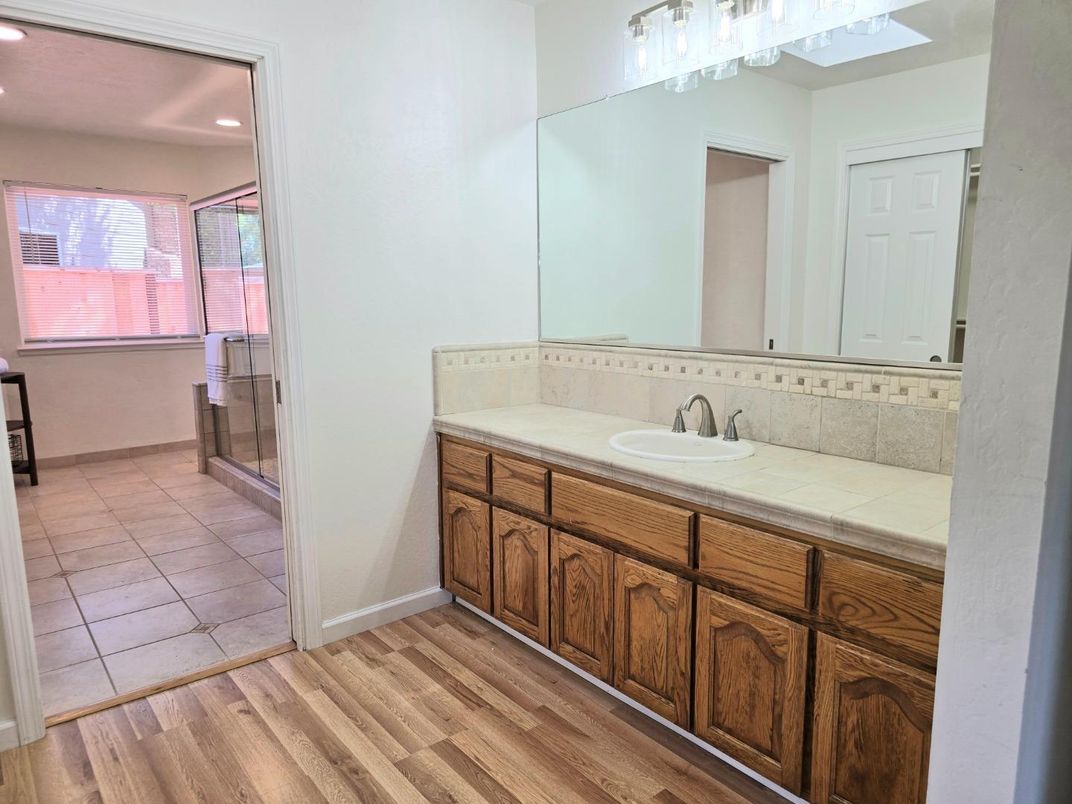 Bathroom, Dual Sink Vanities, Interior, Recessed Lighting, Tile Countertops, Wood Texture Flooring