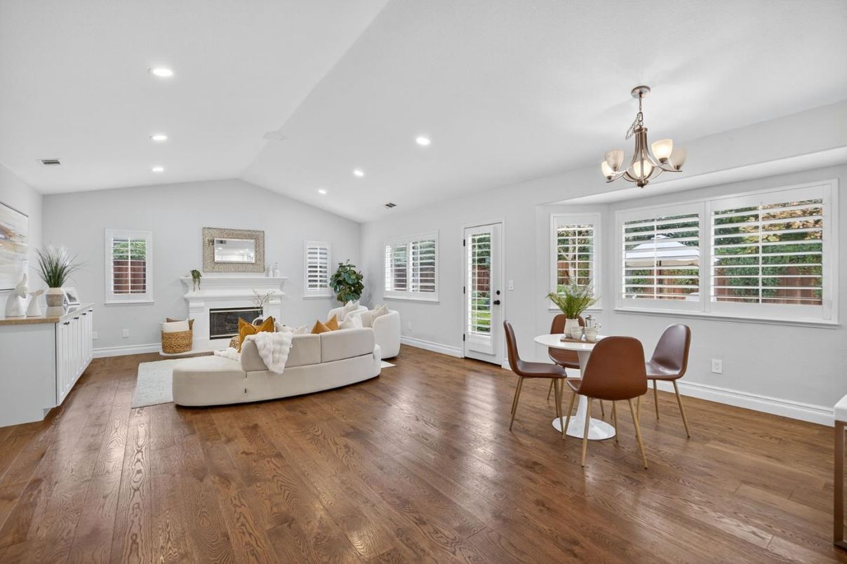 Chandelier, Dining room, Fireplace, Interior, Living room, Recessed Lighting, Wood Texture Flooring