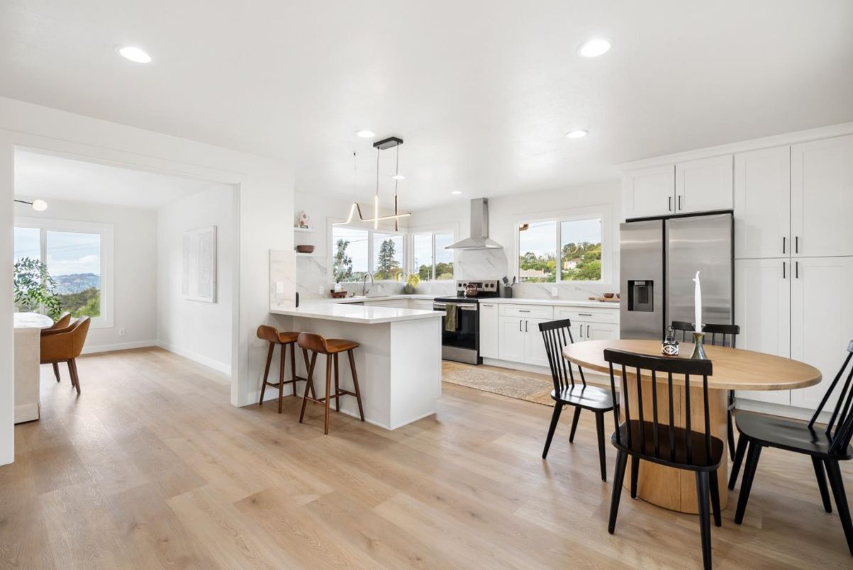 Dining room, Interior, Kitchen, Pendant Lights, Recessed Lighting, Stainless Steel Appliances, Wood Texture Flooring