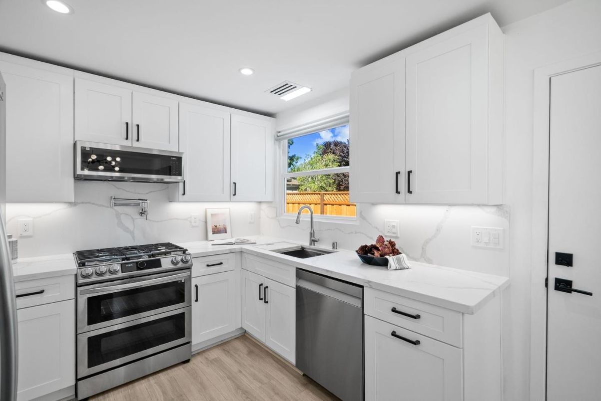 Interior, Kitchen, Marble Walls, Recessed Lighting, Stainless Steel Appliances, Wood Texture Flooring