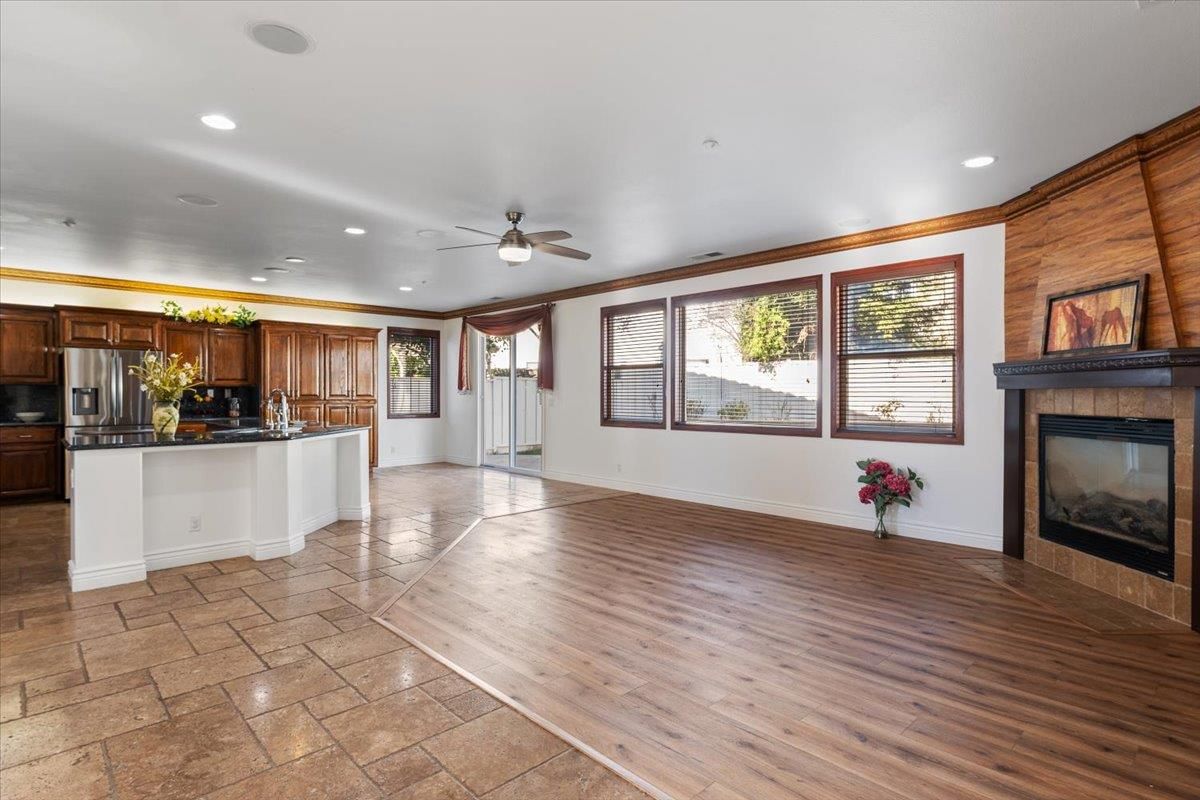 Fireplace, Interior, Kitchen, Recessed Lighting, Stainless Steel Appliances, Wood Texture Flooring