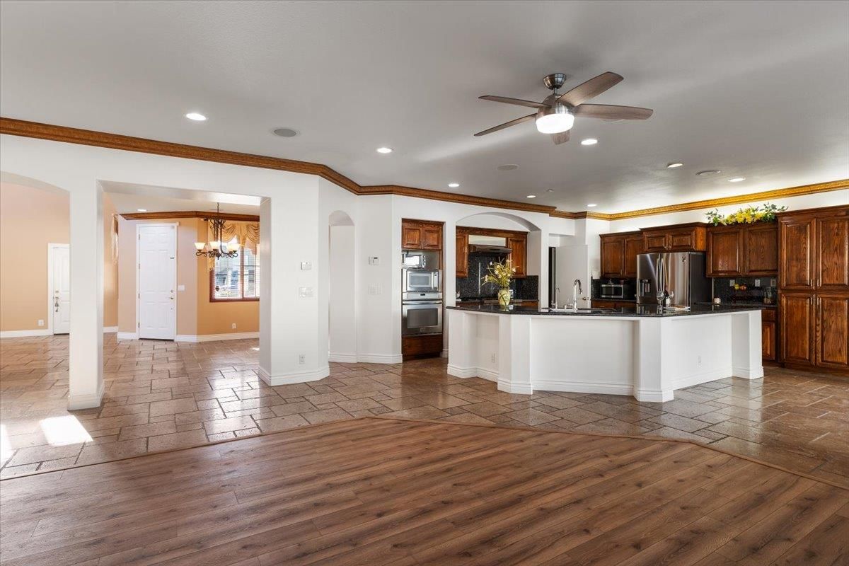 Chandelier, Interior, Kitchen, Recessed Lighting, Stainless Steel Appliances, Wood Texture Flooring