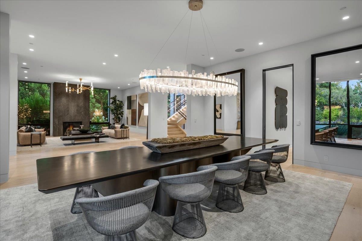 Chandelier, Dining room, Fireplace, Interior, Living room, Pendant Lights, Recessed Lighting, Wood Texture Flooring