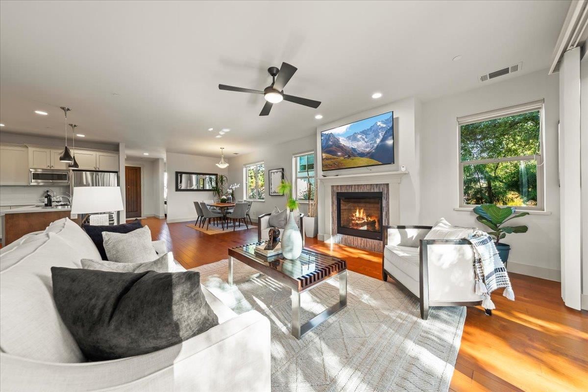 Dining room, Fireplace, Interior, Kitchen, Living room, Pendant Lights, Recessed Lighting, Stainless Steel Appliances, Wood Texture Flooring