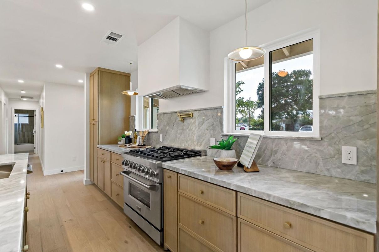 Interior, Kitchen, Marble Walls, Pendant Lights, Recessed Lighting, Stainless Steel Appliances, Wood Texture Flooring
