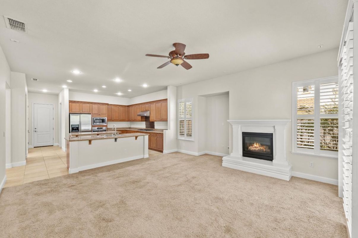 Empty room, Fireplace, Interior, Kitchen, Recessed Lighting, Stainless Steel Appliances