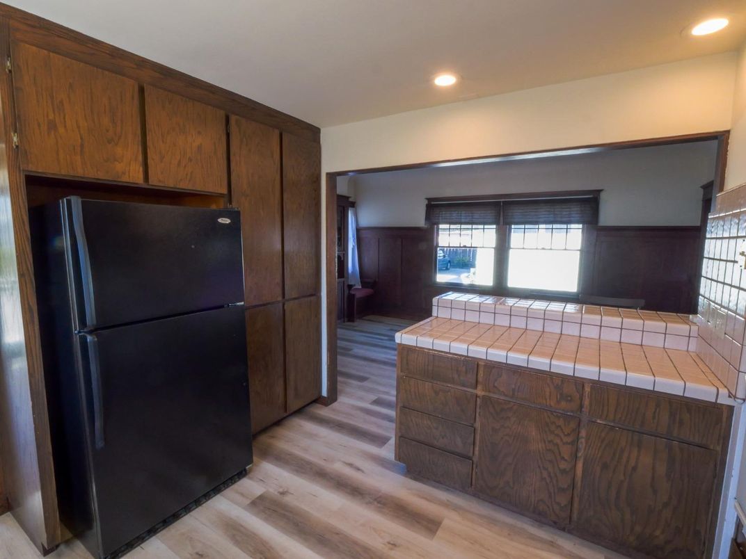 Interior, Kitchen, Recessed Lighting, Tile Countertops, Wood Texture Flooring