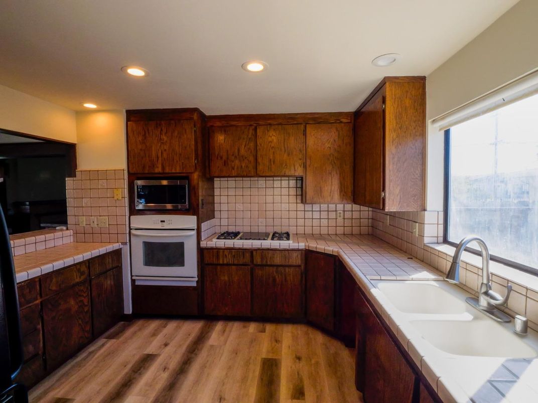 Interior, Kitchen, Recessed Lighting, Tile Countertops, Wood Texture Flooring