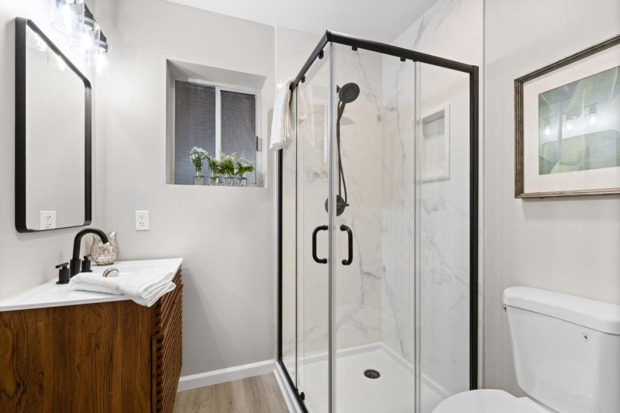 Bathroom, Glass Shower, Interior, Marble Walls, Wood Texture Flooring