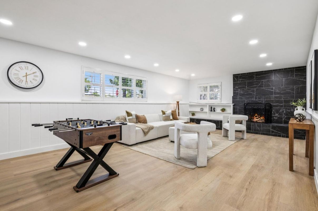 Fireplace, Game Room, Interior, Living room, Recessed Lighting, Wood Texture Flooring
