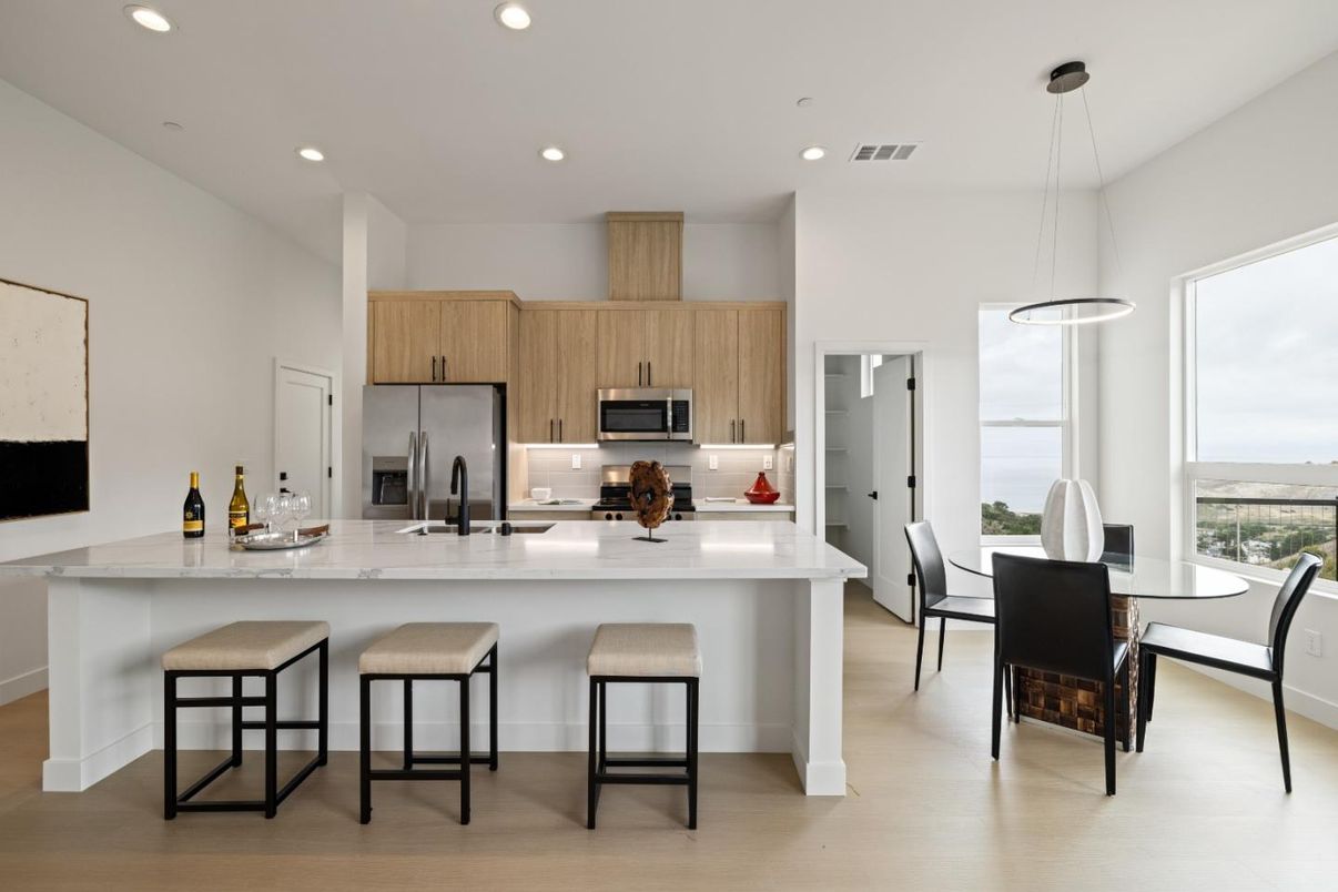 Dining room, Interior, Kitchen, Pendant Lights, Recessed Lighting, Stainless Steel Appliances, Water, Wood Texture Flooring