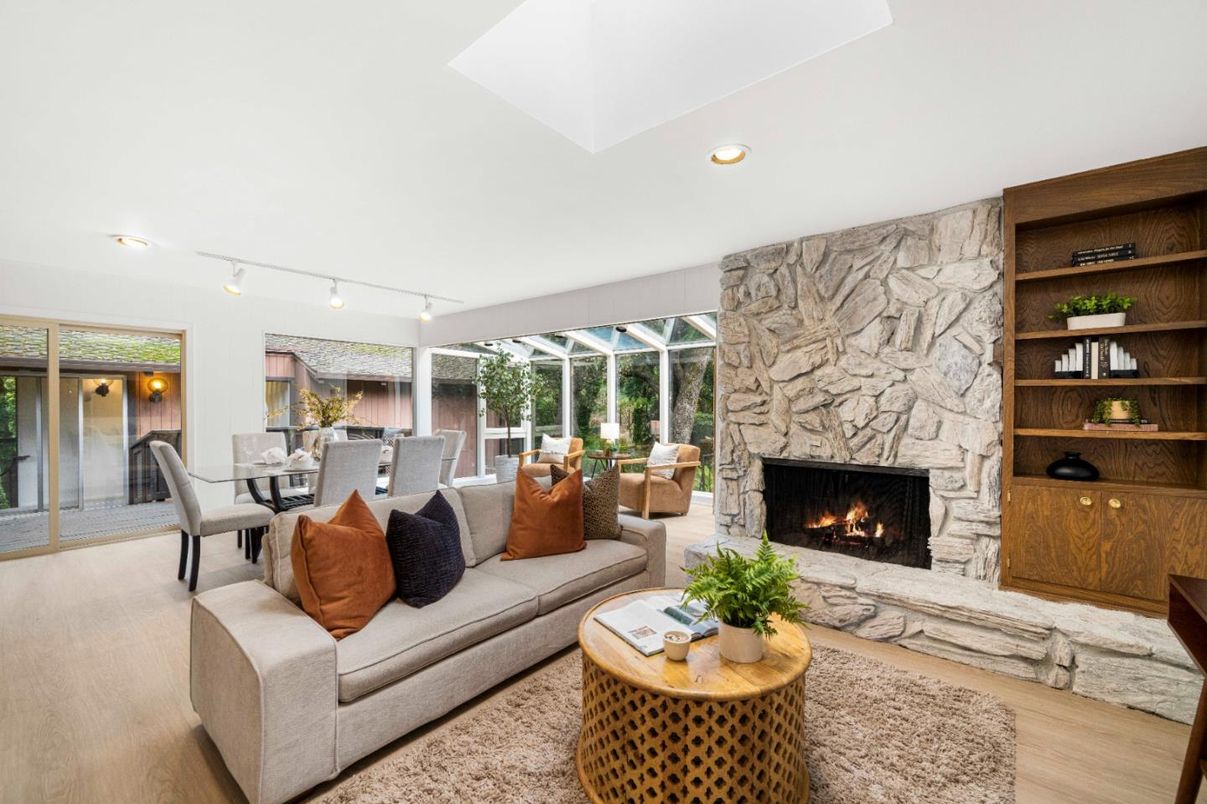 Dining room, Fireplace, Interior, Living room, Recessed Lighting, Stone Walls, Wood Texture Flooring