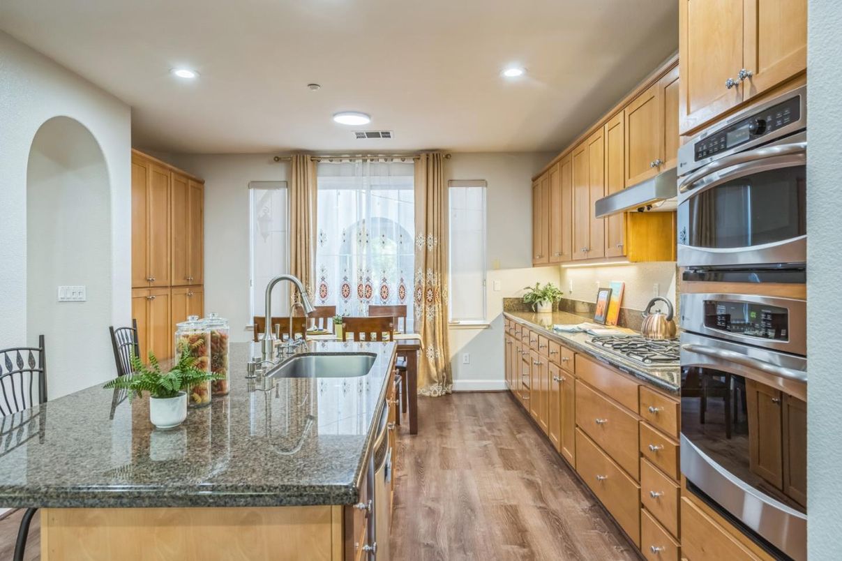 Dining room, Interior, Kitchen, Recessed Lighting, Stainless Steel Appliances, Wood Texture Flooring
