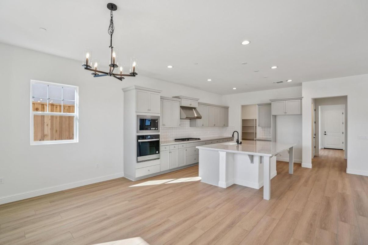 Chandelier, Interior, Kitchen, Pendant Lights, Recessed Lighting, Stainless Steel Appliances, Wood Texture Flooring