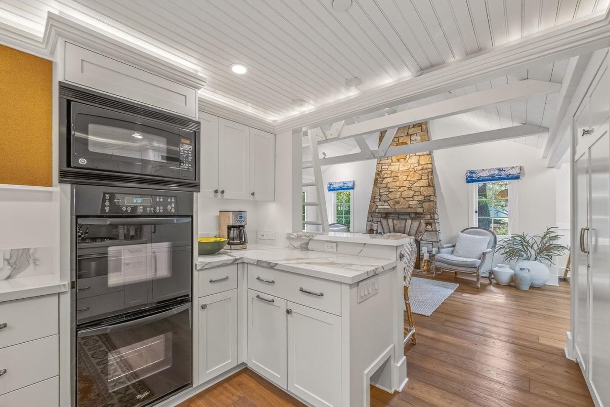 Fireplace, Interior, Kitchen, Recessed Lighting, Stainless Steel Appliances, Wood Texture Flooring