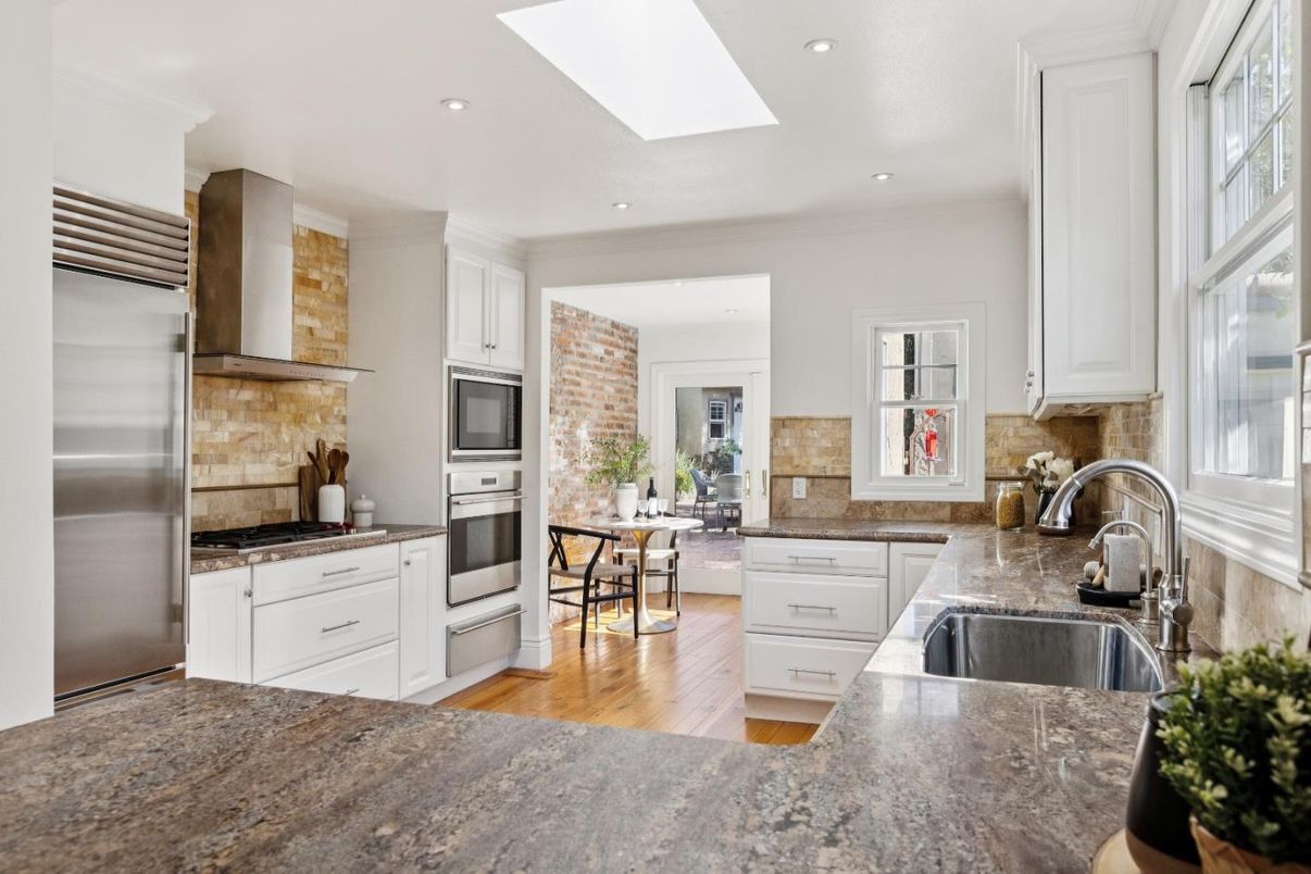 Dining room, Interior, Kitchen, Recessed Lighting, Stainless Steel Appliances, Stone Walls, Wood Texture Flooring