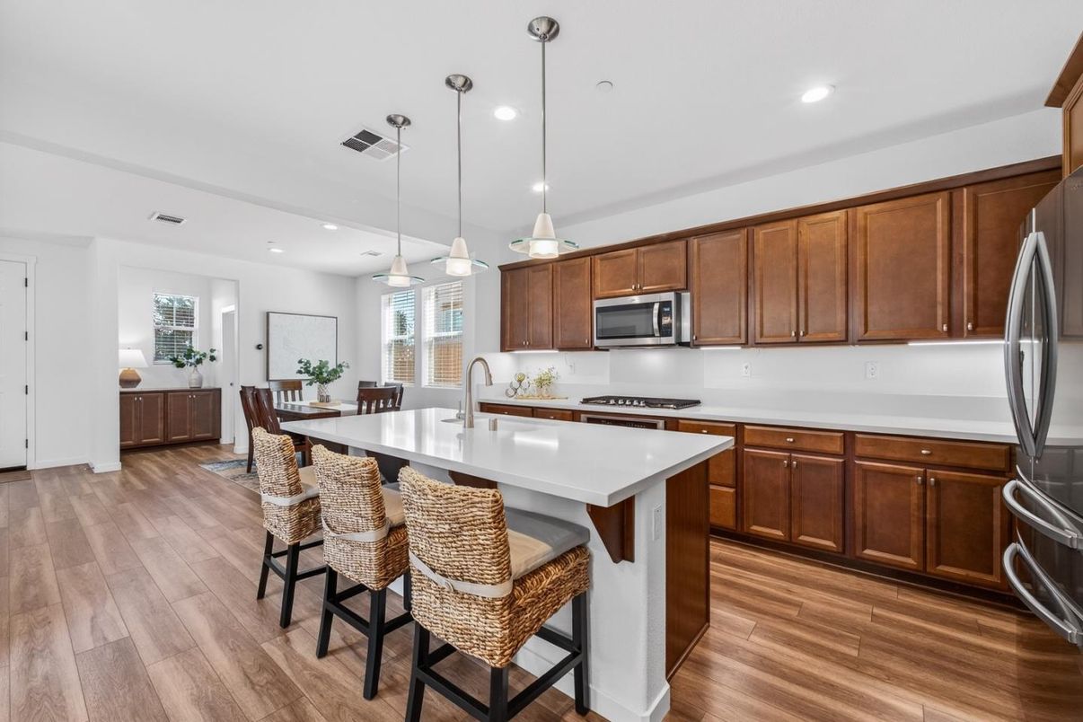 Dining room, Interior, Kitchen, Pendant Lights, Recessed Lighting, Stainless Steel Appliances, Wood Texture Flooring