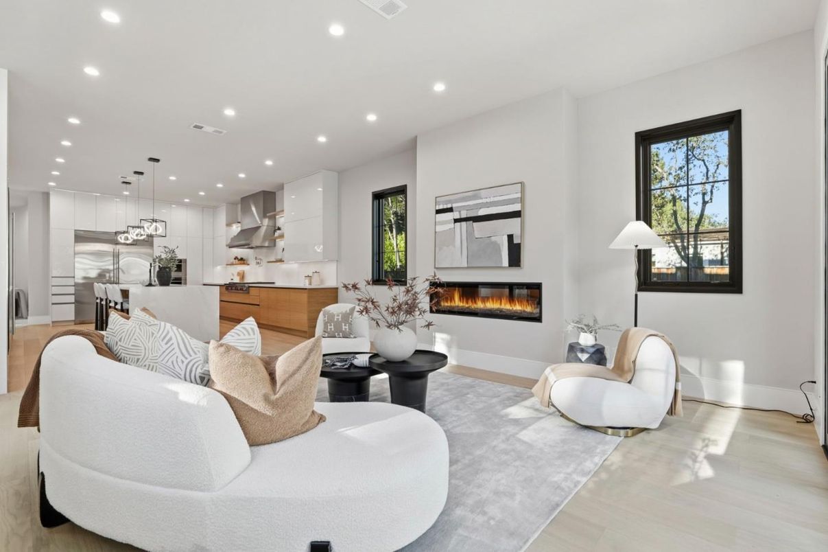 Fireplace, Interior, Kitchen, Living room, Pendant Lights, Recessed Lighting, Stainless Steel Appliances, Wood Texture Flooring