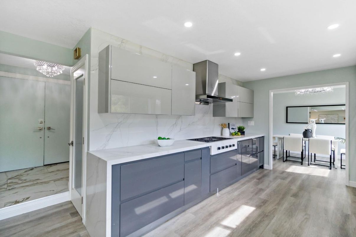 Interior, Kitchen, Marble Walls, Recessed Lighting, Stainless Steel Appliances, Wood Texture Flooring