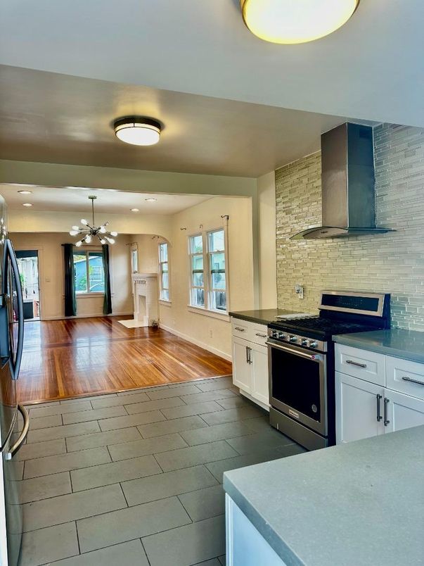 Interior, Kitchen, Pendant Lights, Recessed Lighting, Stainless Steel Appliances, Stone Walls, Wood Texture Flooring