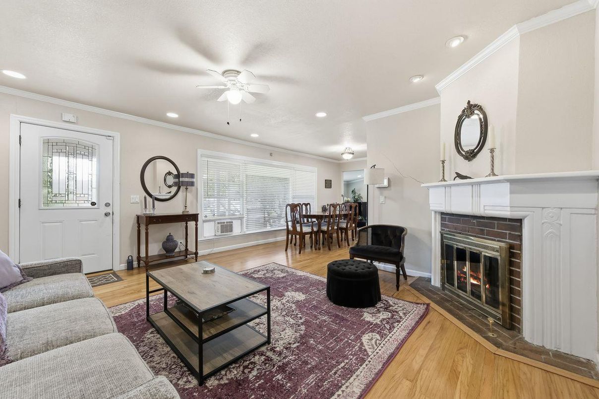 Dining room, Fireplace, Interior, Living room, Recessed Lighting, Wood Texture Flooring