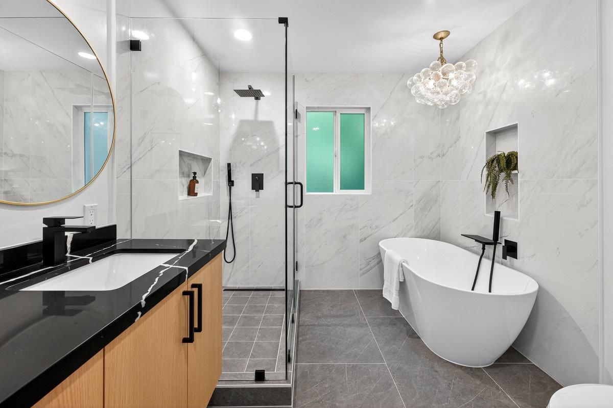 Bathroom, Dual Sink Vanities, Free Standing Baths, Glass Shower, Interior, Marble Walls, Pendant Lights, Recessed Lighting