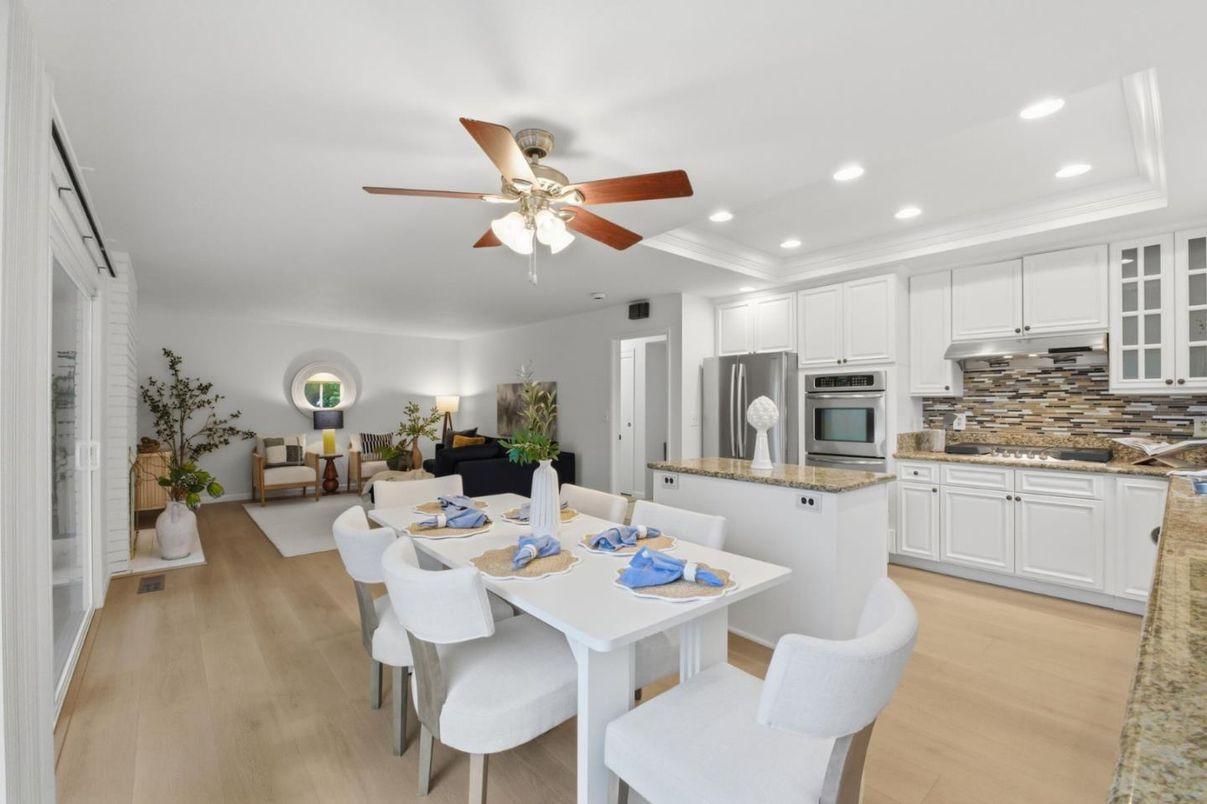 Dining room, Interior, Kitchen, Living room, Recessed Lighting, Stainless Steel Appliances, Wood Texture Flooring
