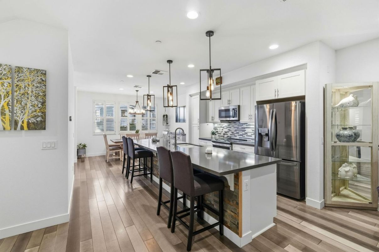 Dining room, Interior, Kitchen, Pendant Lights, Recessed Lighting, Stainless Steel Appliances, Wood Texture Flooring