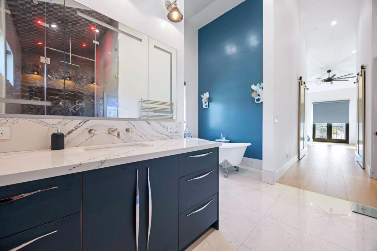 Bathroom, Free Standing Baths, Interior, Marble Walls, Recessed Lighting, Wood Texture Flooring