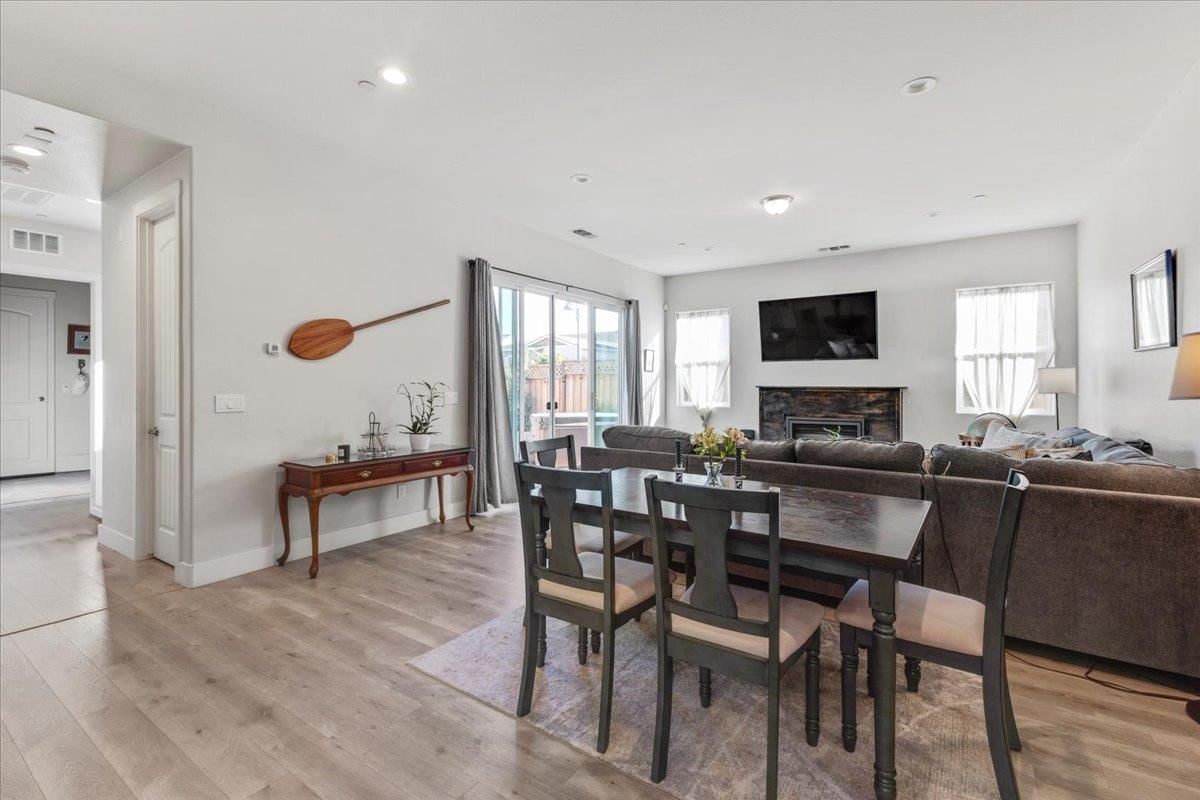 Dining room, Fireplace, Interior, Living room, Recessed Lighting, Wood Texture Flooring