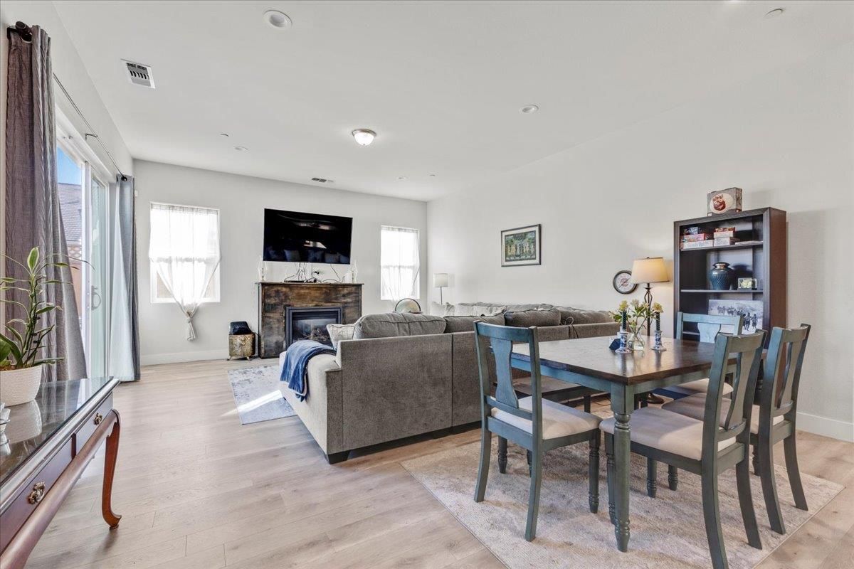 Dining room, Fireplace, Interior, Living room, Recessed Lighting, Wood Texture Flooring