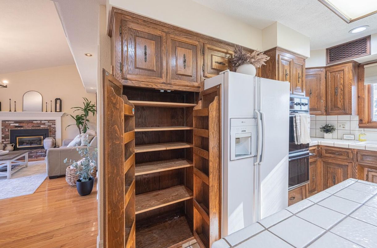 Fireplace, Interior, Kitchen, Living room, Recessed Lighting, Tile Countertops, Wood Texture Flooring