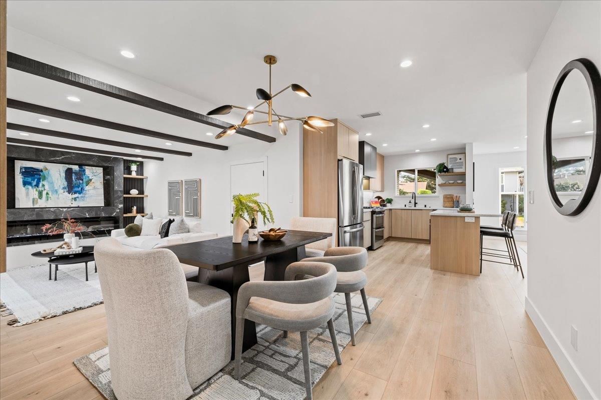 Dining room, Fireplace, Interior, Kitchen, Living room, Pendant Lights, Recessed Lighting, Stainless Steel Appliances, Wood Texture Flooring