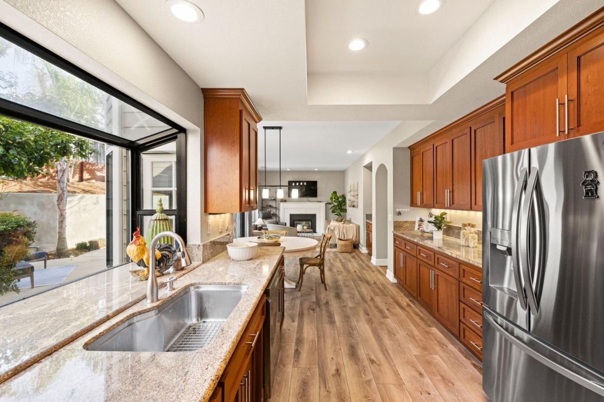 Dining room, Fireplace, Interior, Kitchen, Pendant Lights, Recessed Lighting, Stainless Steel Appliances, Wood Texture Flooring