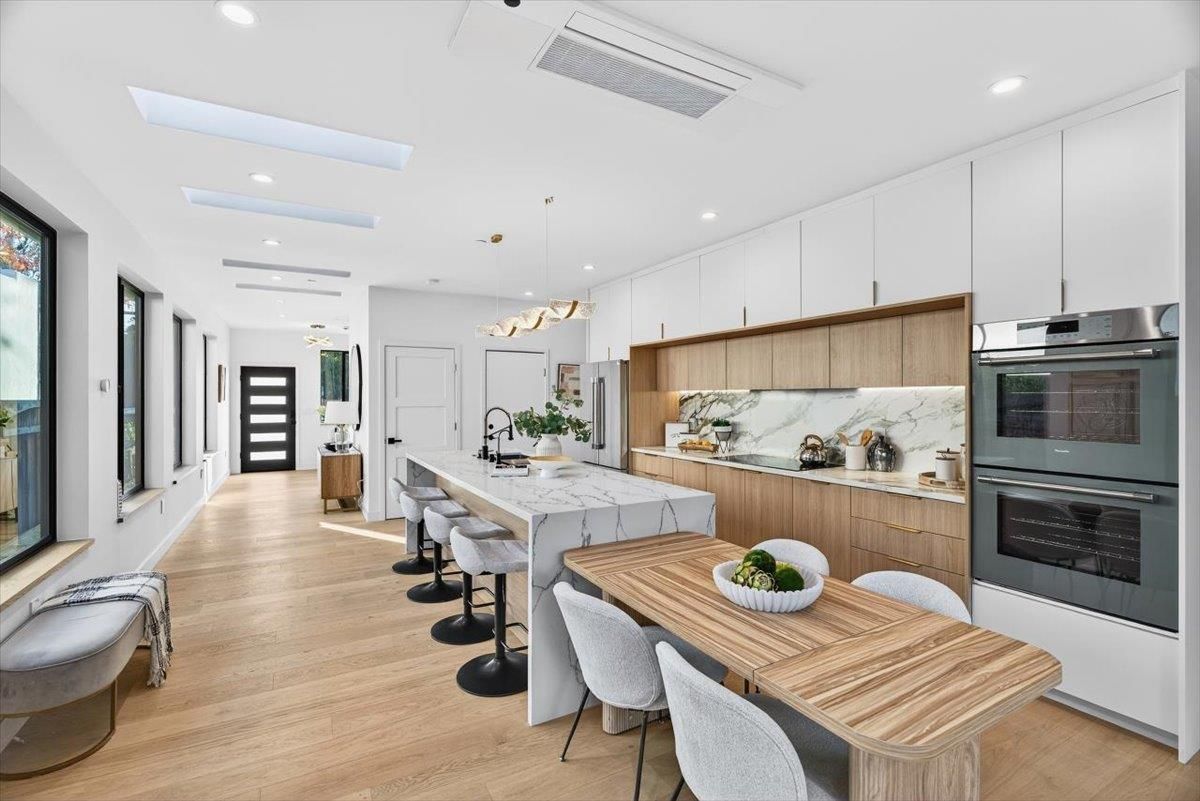 Dining room, Interior, Kitchen, Marble Walls, Pendant Lights, Recessed Lighting, Stainless Steel Appliances, Wood Texture Flooring