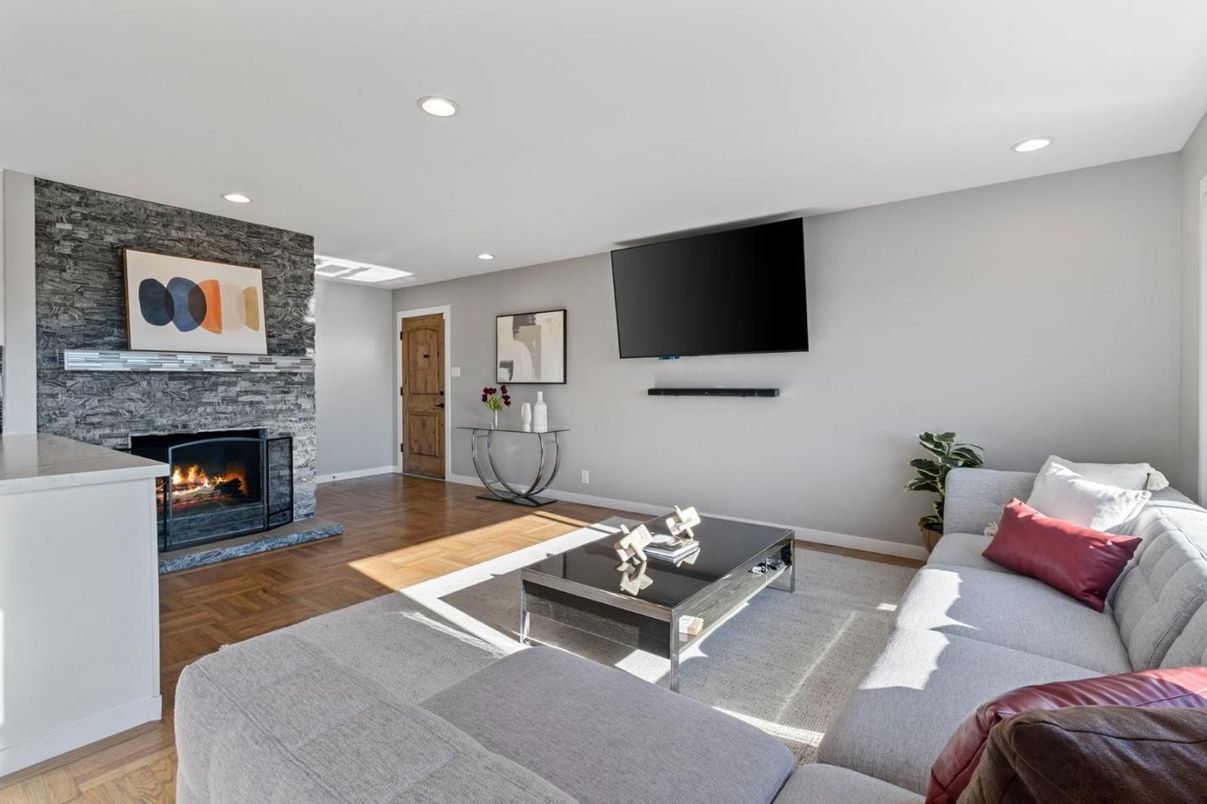 Fireplace, Interior, Living room, Recessed Lighting, Stone Walls, Wood Texture Flooring