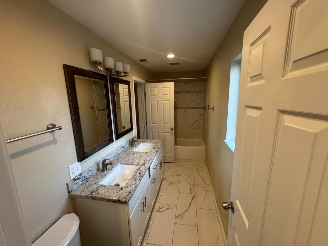 Bathroom, Dual Sink Vanities, Interior, Marble, Marble Walls, Recessed Lighting