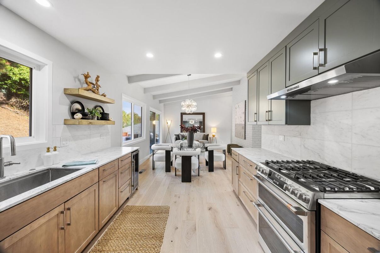 Chandelier, Dining room, Interior, Kitchen, Living room, Marble Walls, Pendant Lights, Recessed Lighting, Stainless Steel Appliances, Wood Texture Flooring