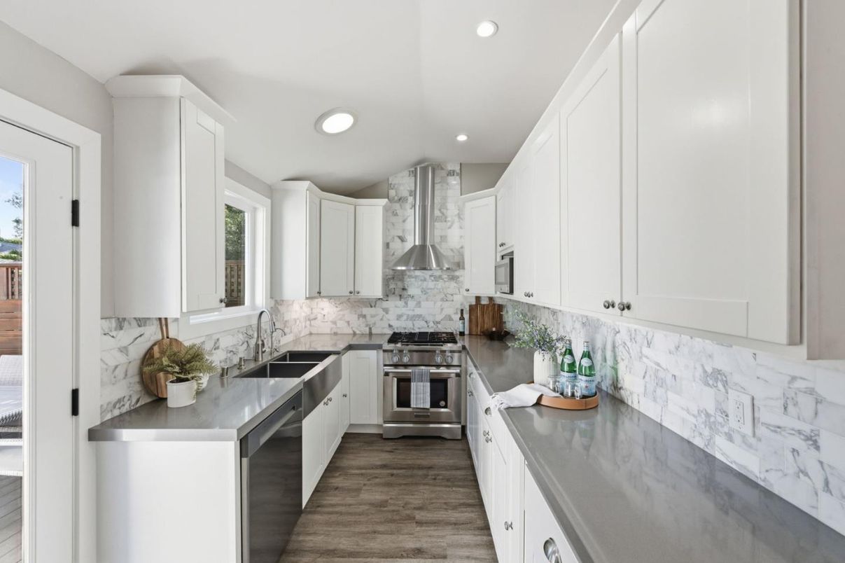 Interior, Kitchen, Marble Walls, Recessed Lighting, Stainless Steel Appliances, Wood Texture Flooring