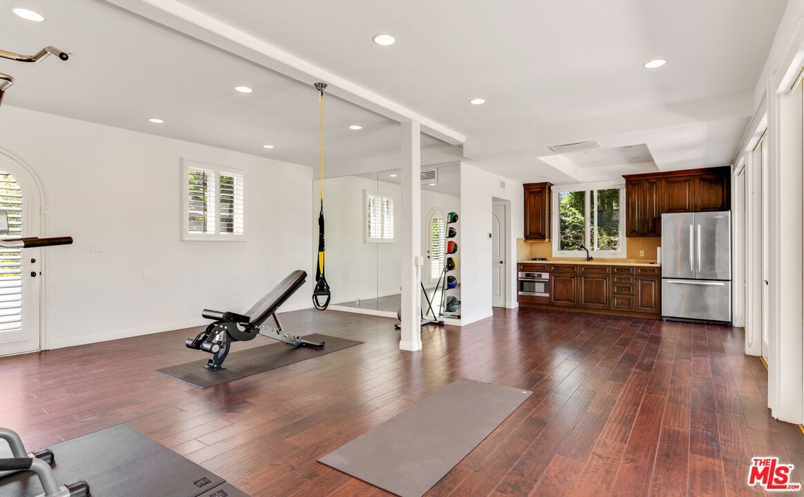 Fitness Equipment, Interior, Kitchen, Recessed Lighting, Stainless Steel Appliances, Wood Texture Flooring
