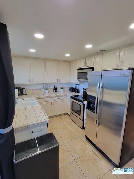 Interior, Kitchen, Recessed Lighting, Stainless Steel Appliances, Tile Countertops