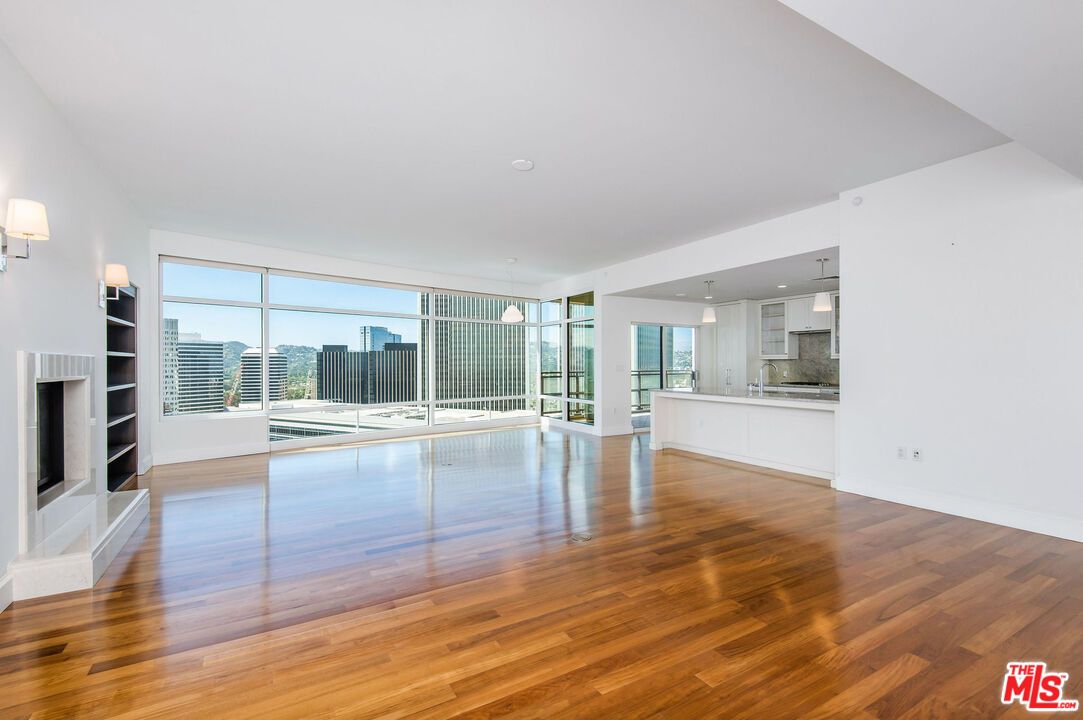 Empty room, Fireplace, Interior, Kitchen, Pendant Lights, Recessed Lighting, Wood Texture Flooring