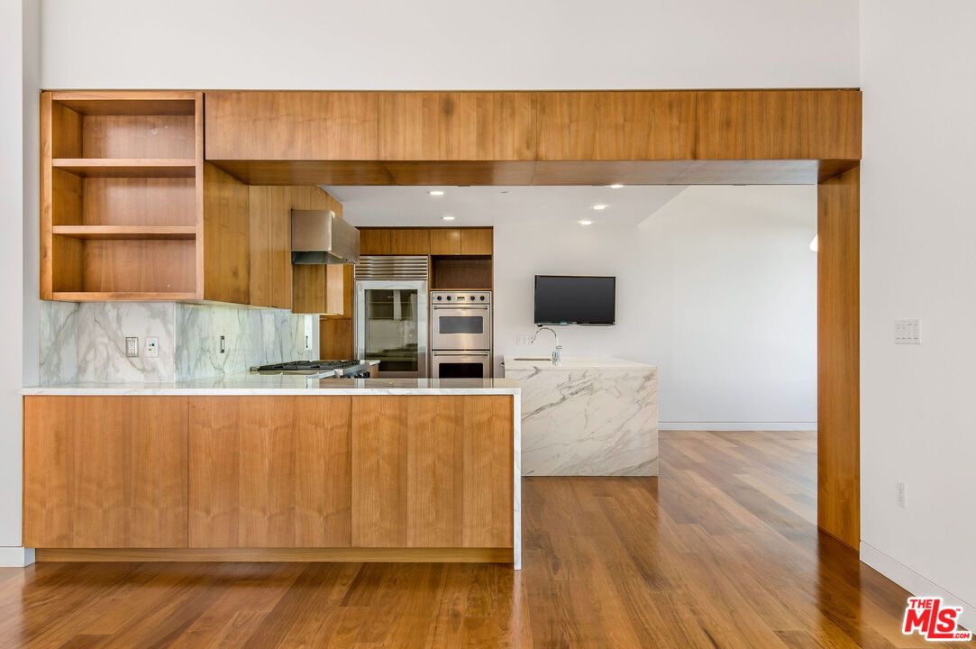 Interior, Kitchen, Marble Walls, Recessed Lighting, Stainless Steel Appliances, Wood Texture Flooring